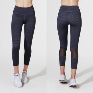 Varley striped downing tight- mesh insert leggings.